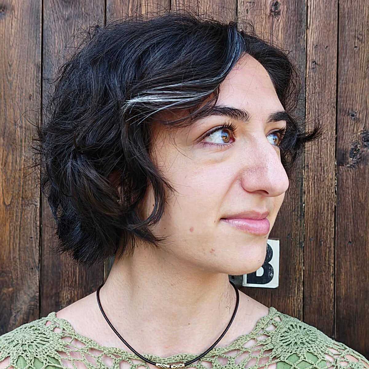 Chin-length dark wavy bob with natural silver streaks
