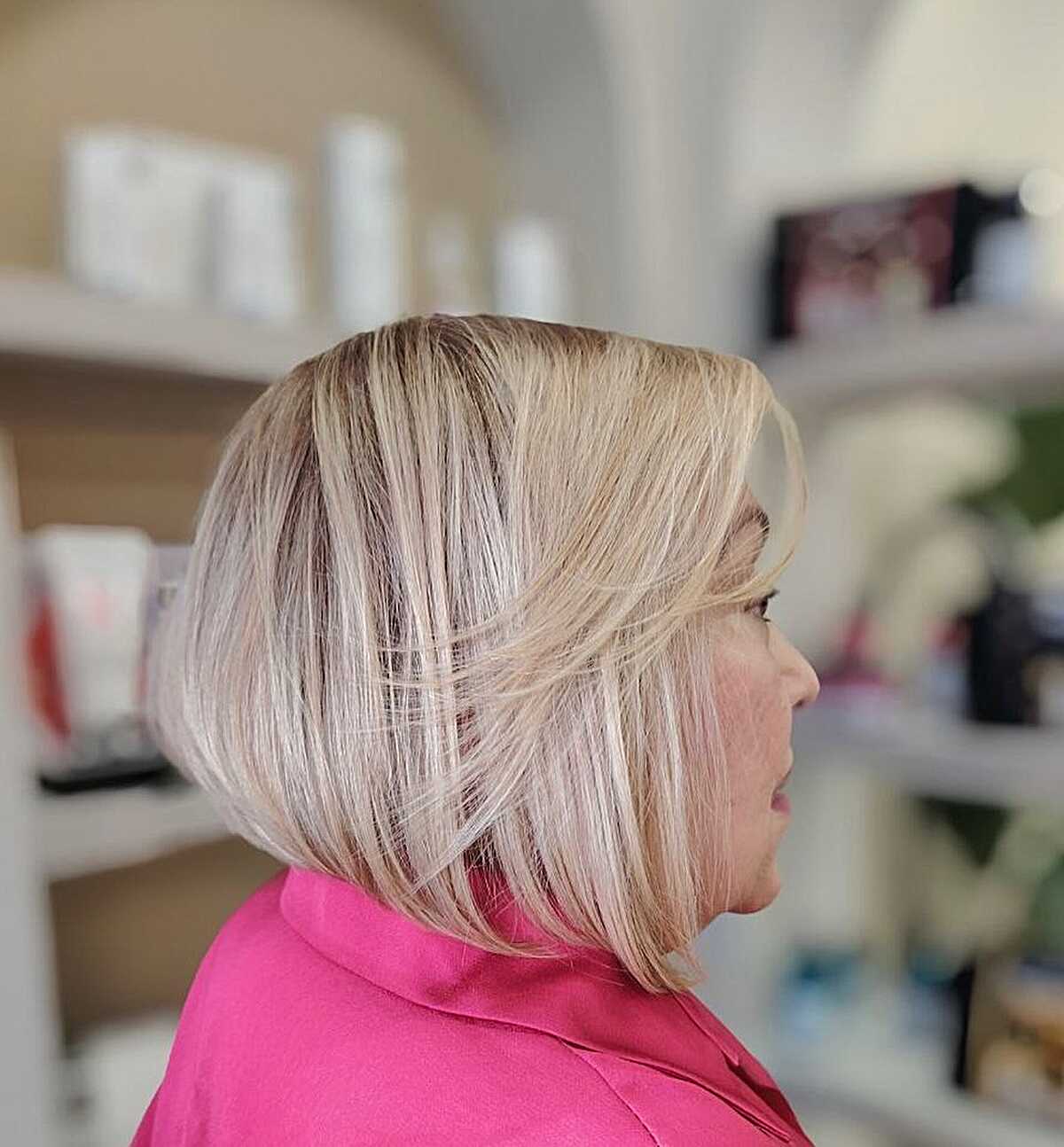 Icy blonde voluminous layered bob from the back