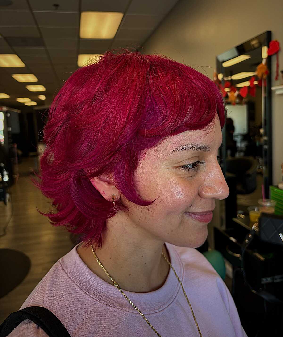Vibrant magenta pixie bob with flipped wavy ends