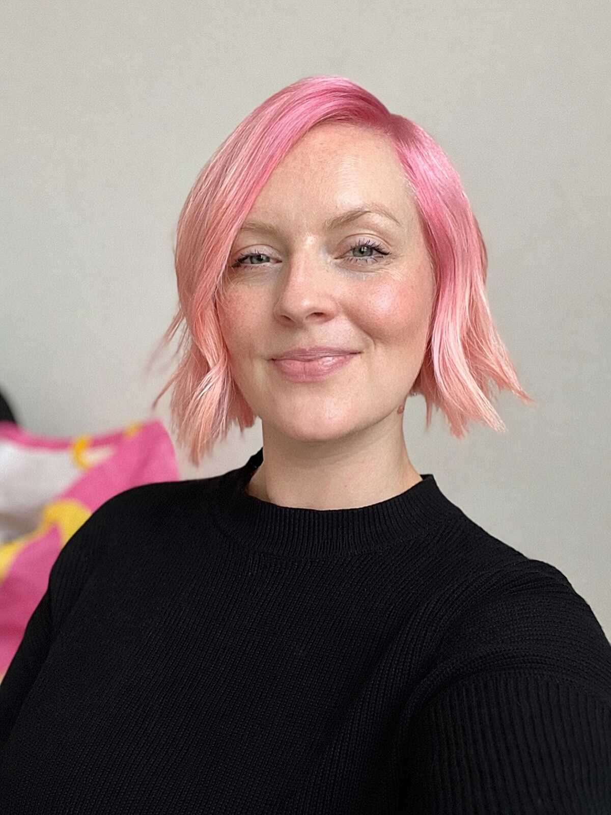 Peach pink chin-length bob with undone texture