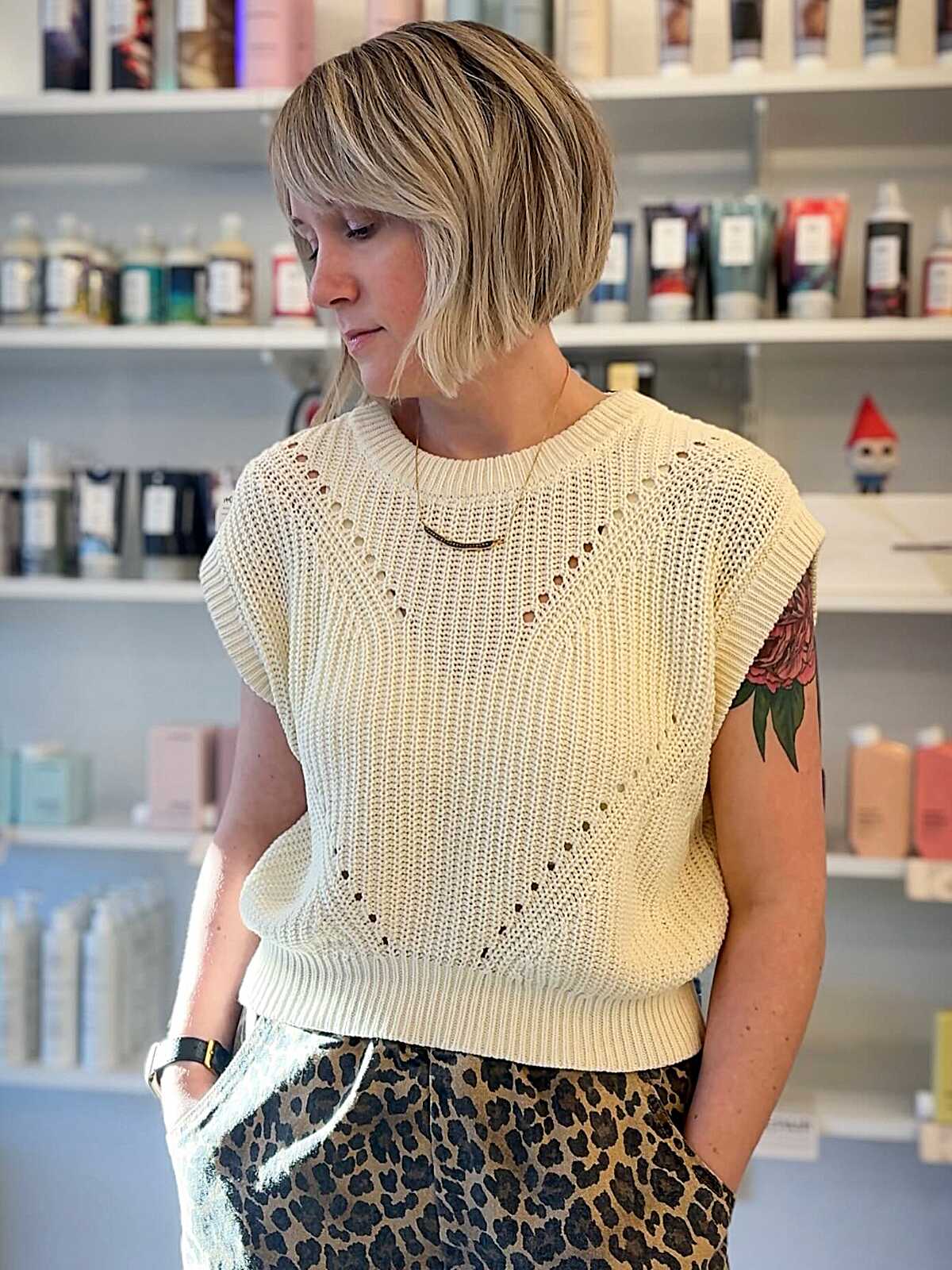 Textured chin-length sandy blonde bob with highlights