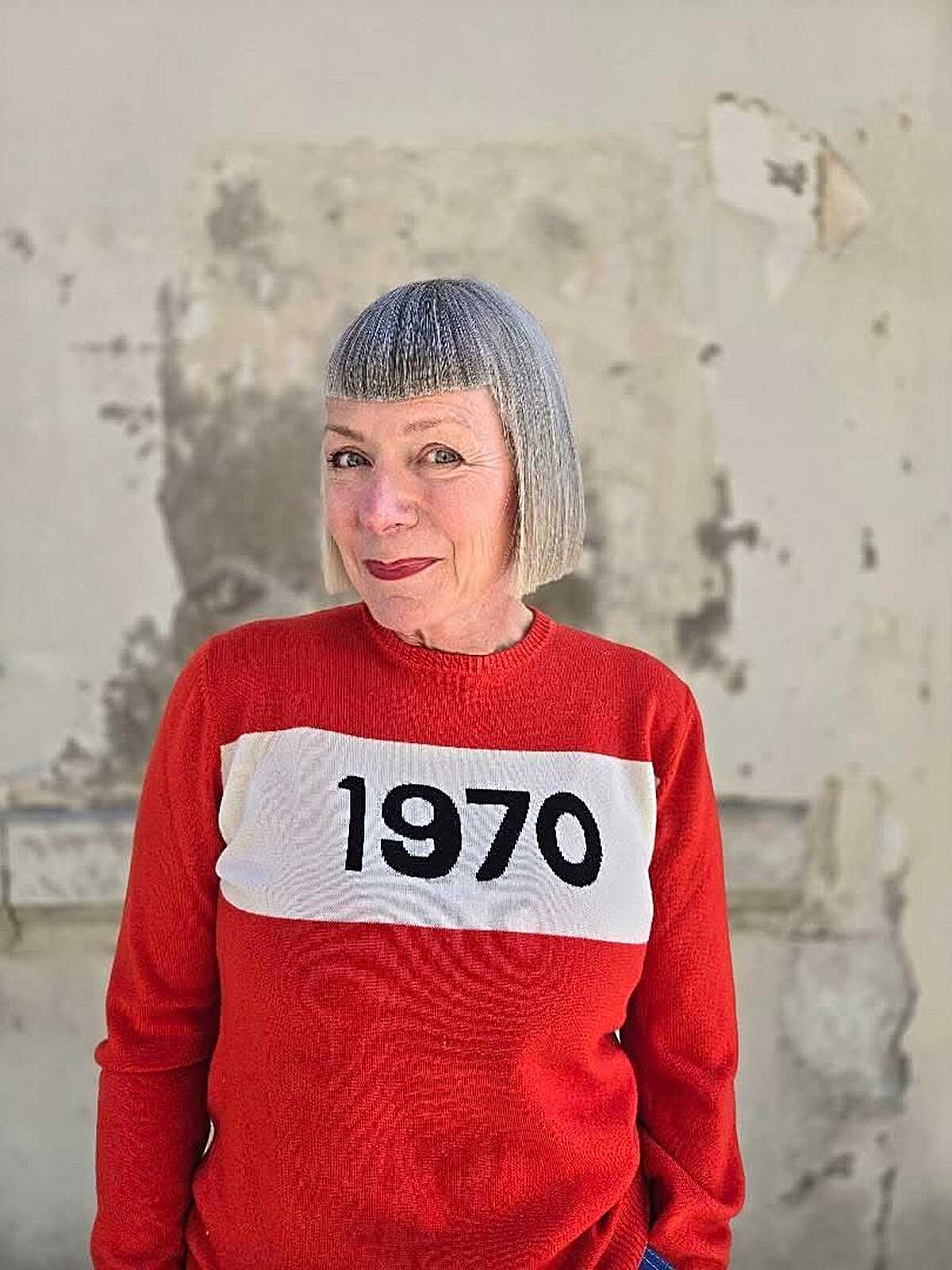 Silver gray chin-length bowl bob with blunt bangs