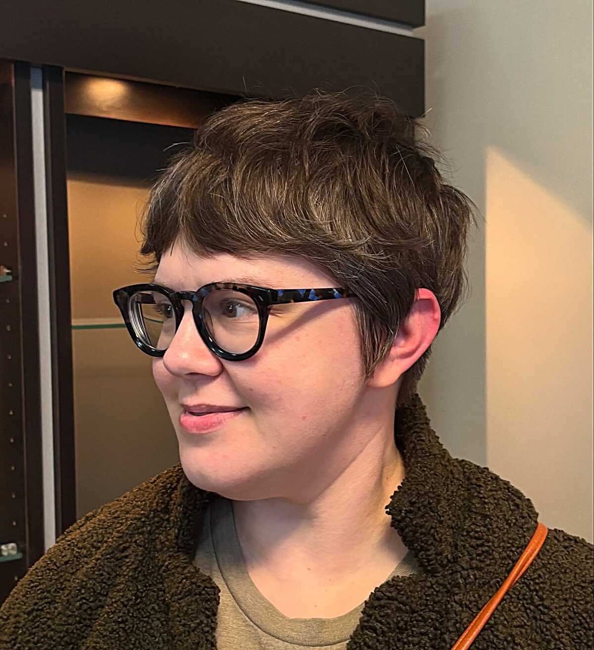 Textured ash brown pixie cut with soft layered top