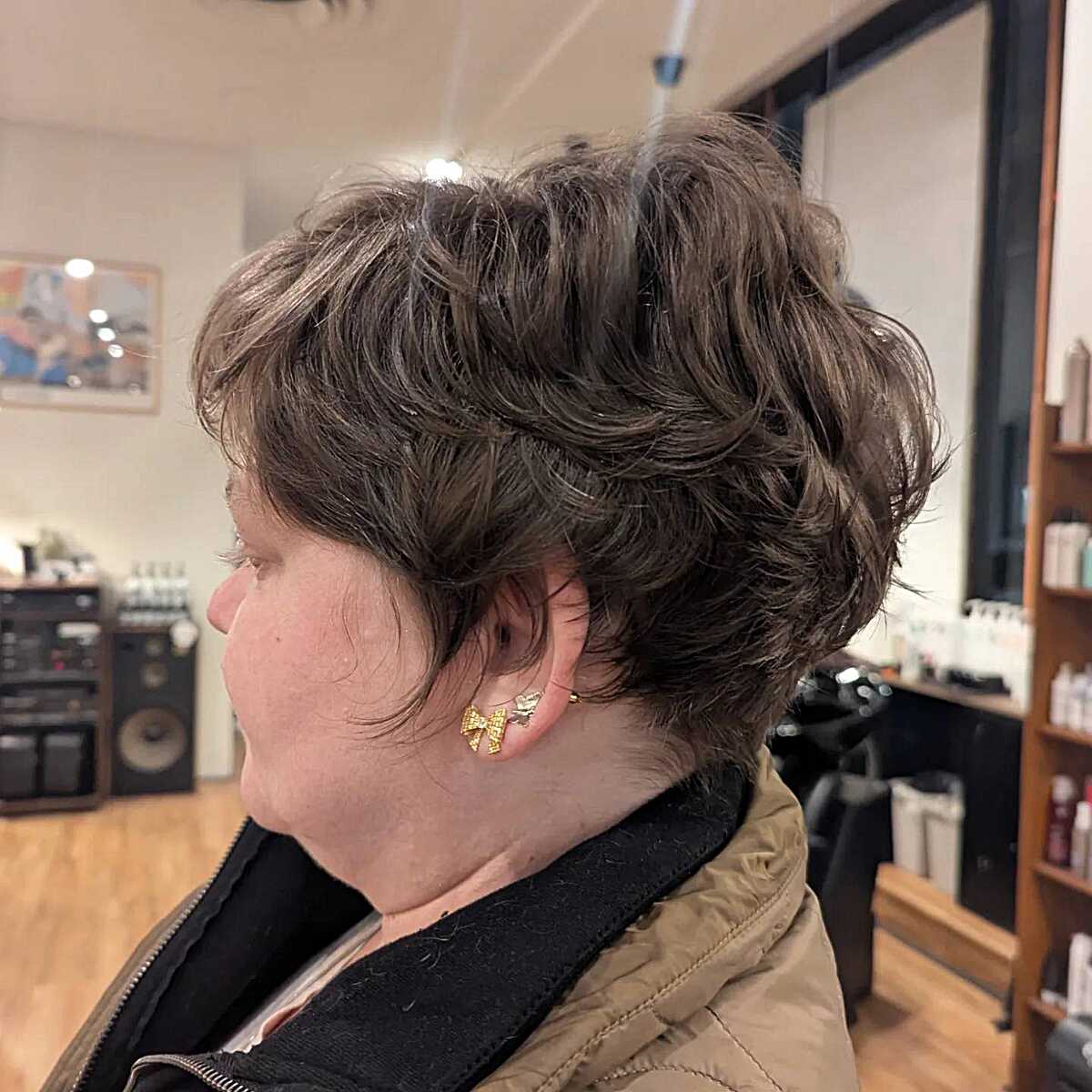 Wavy brown stacked pixie with side-swept volume