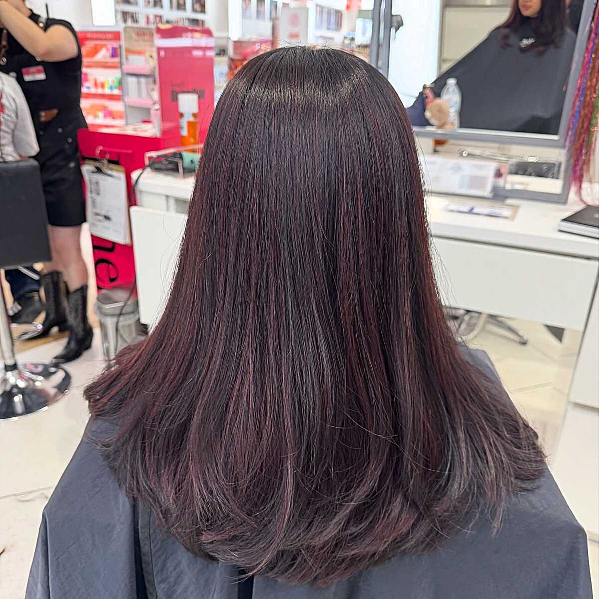 Medium dark brown straight hair with subtle plum red wash