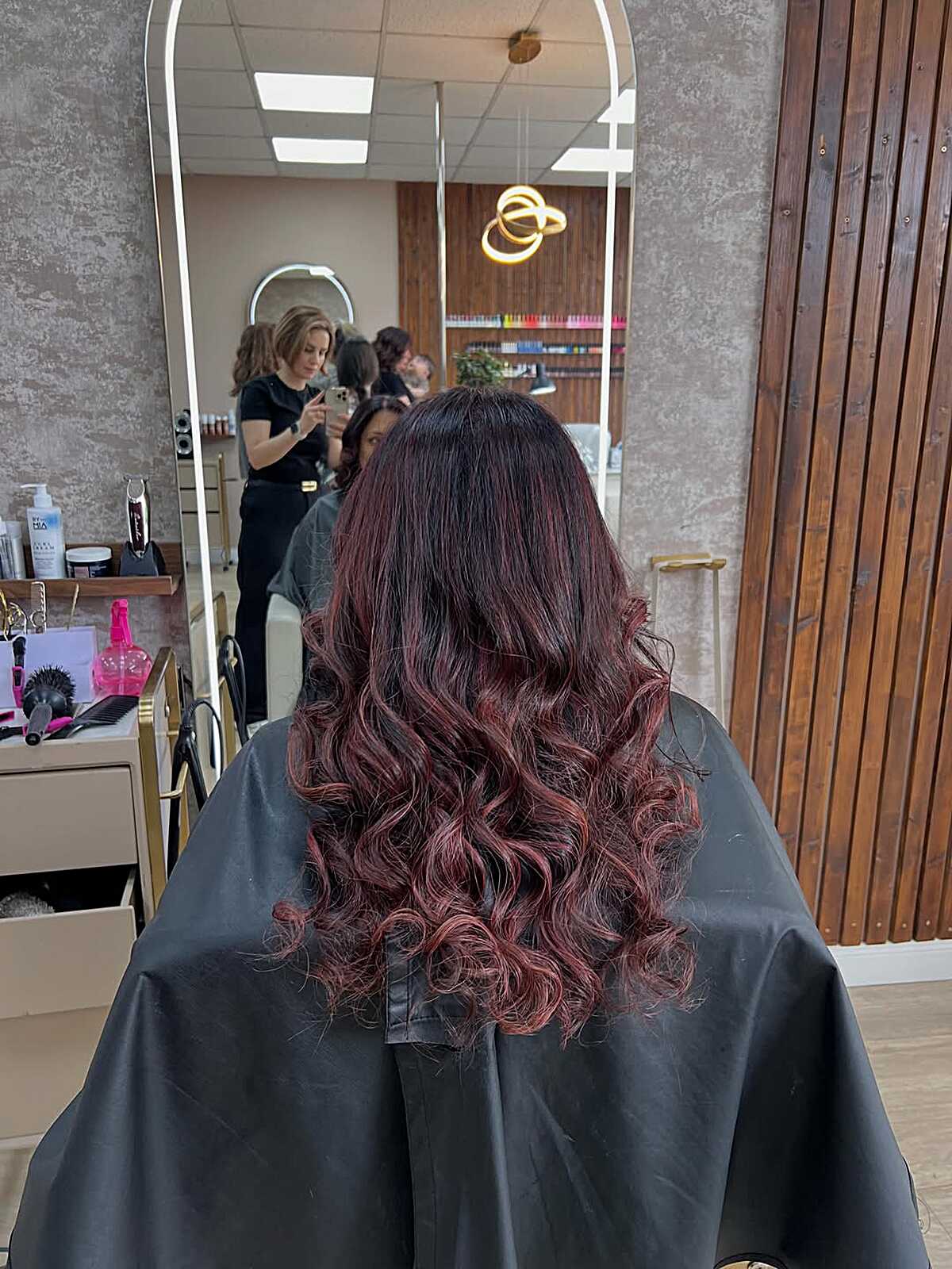 Black to burgundy red ombre with long cascading curls
