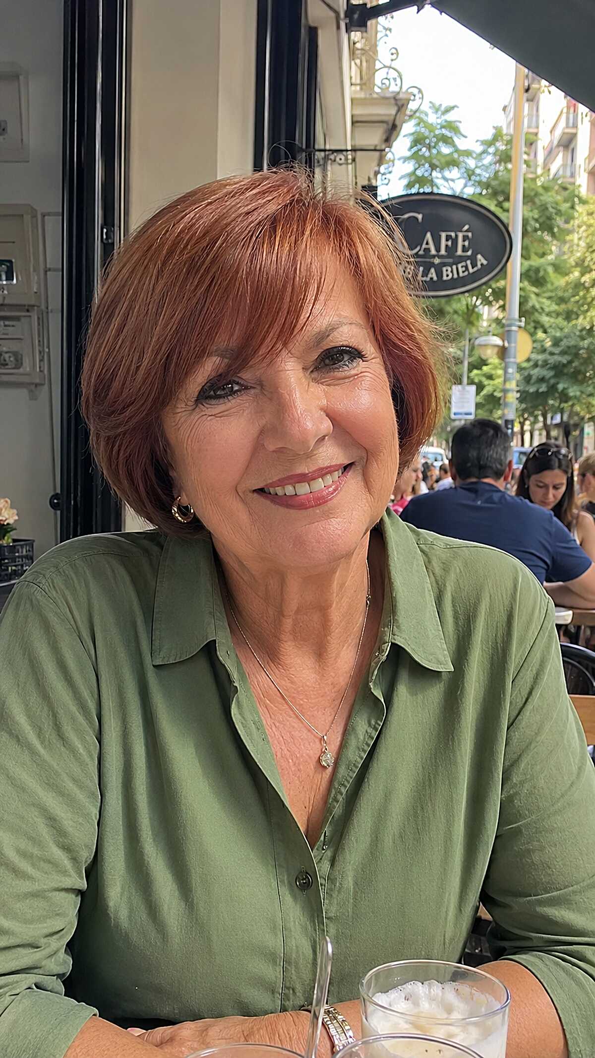 Bold copper red short bob with blunt bangs