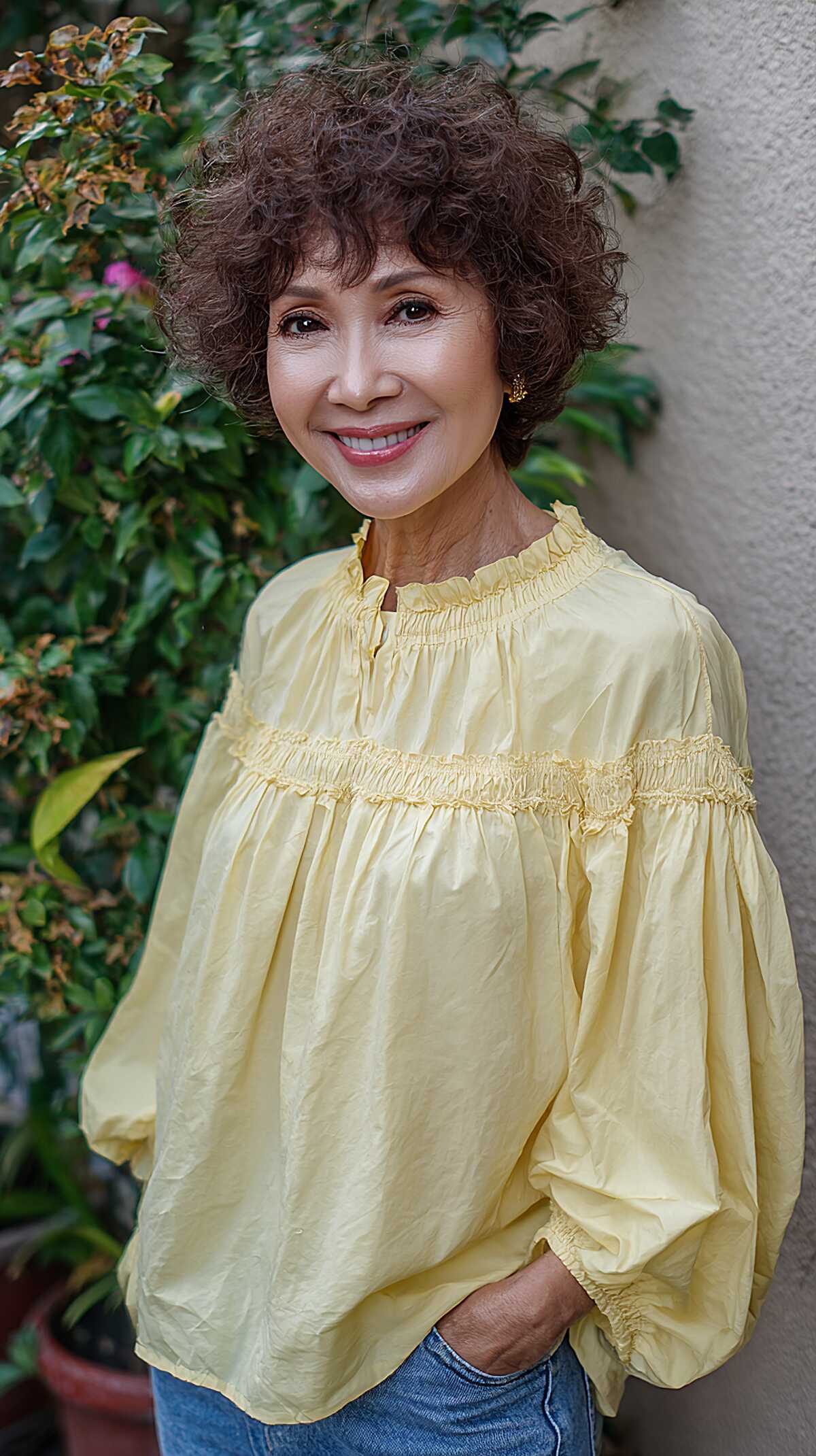 Short deep brown curly shag with compact round shape