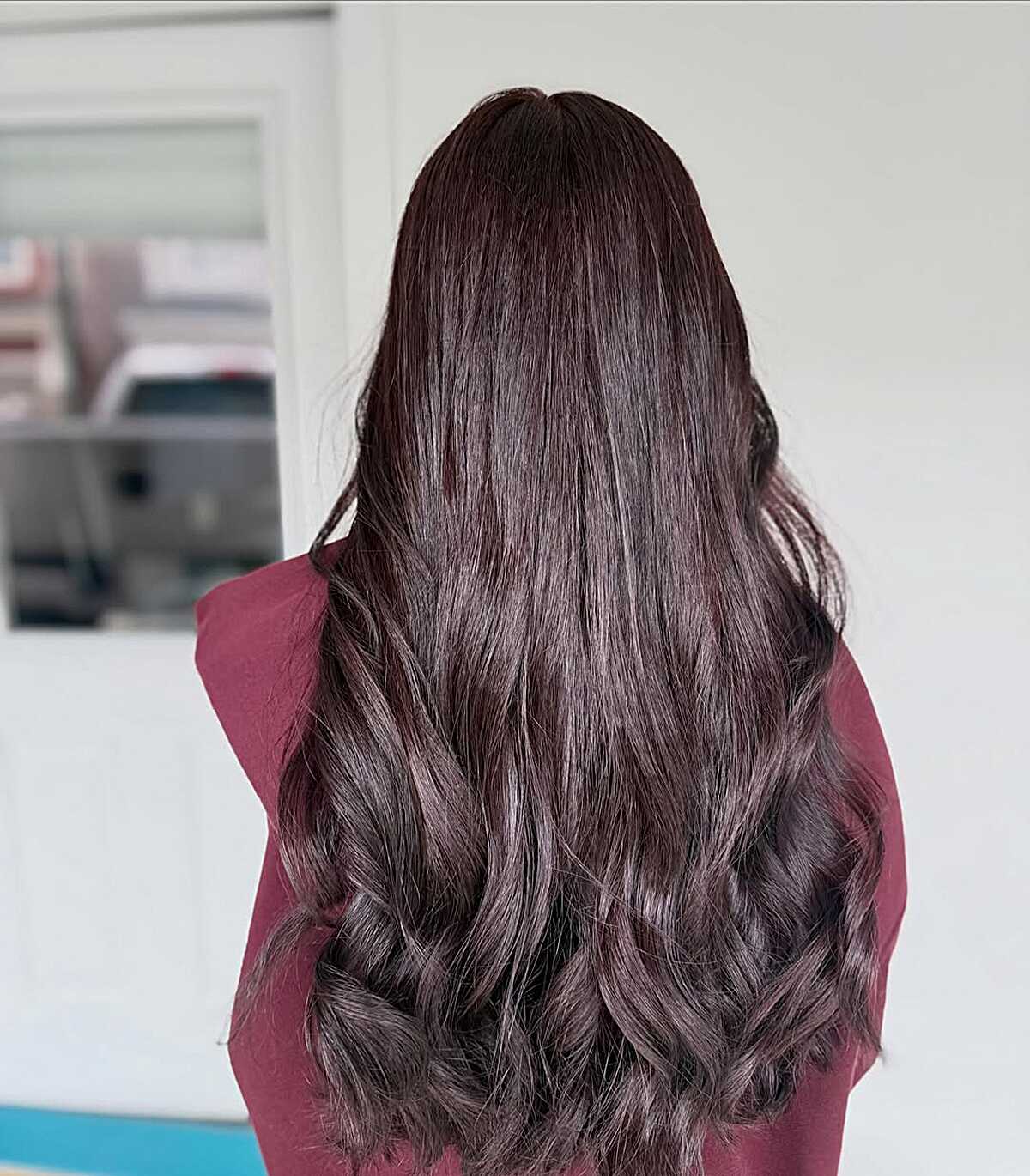 Long dark chocolate brown hair with subtle plum undertone