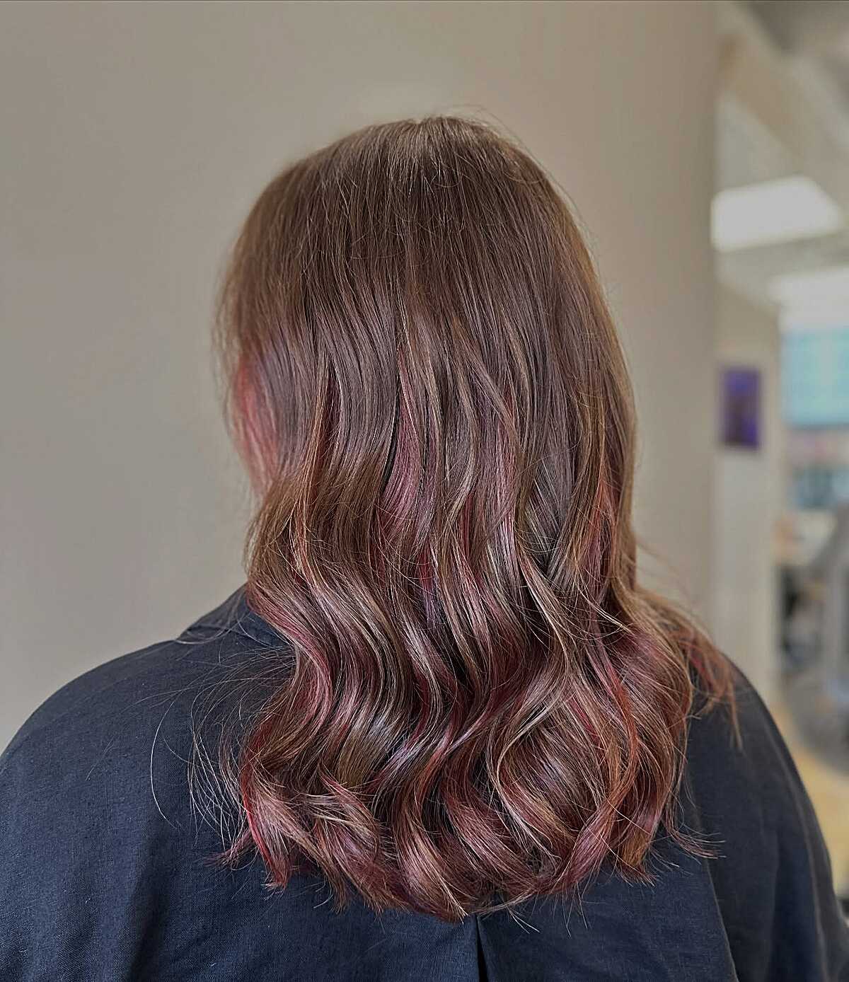 Wavy mushroom brown hair with subtle dusty rose highlights