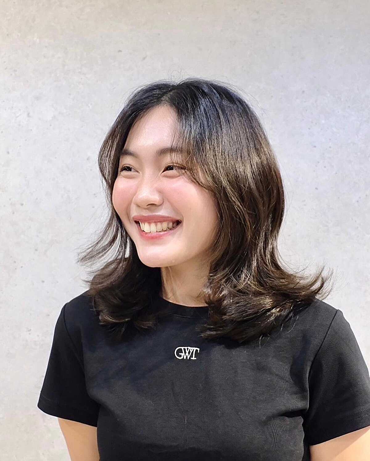 Dark brown shoulder-length layers with flippy ends