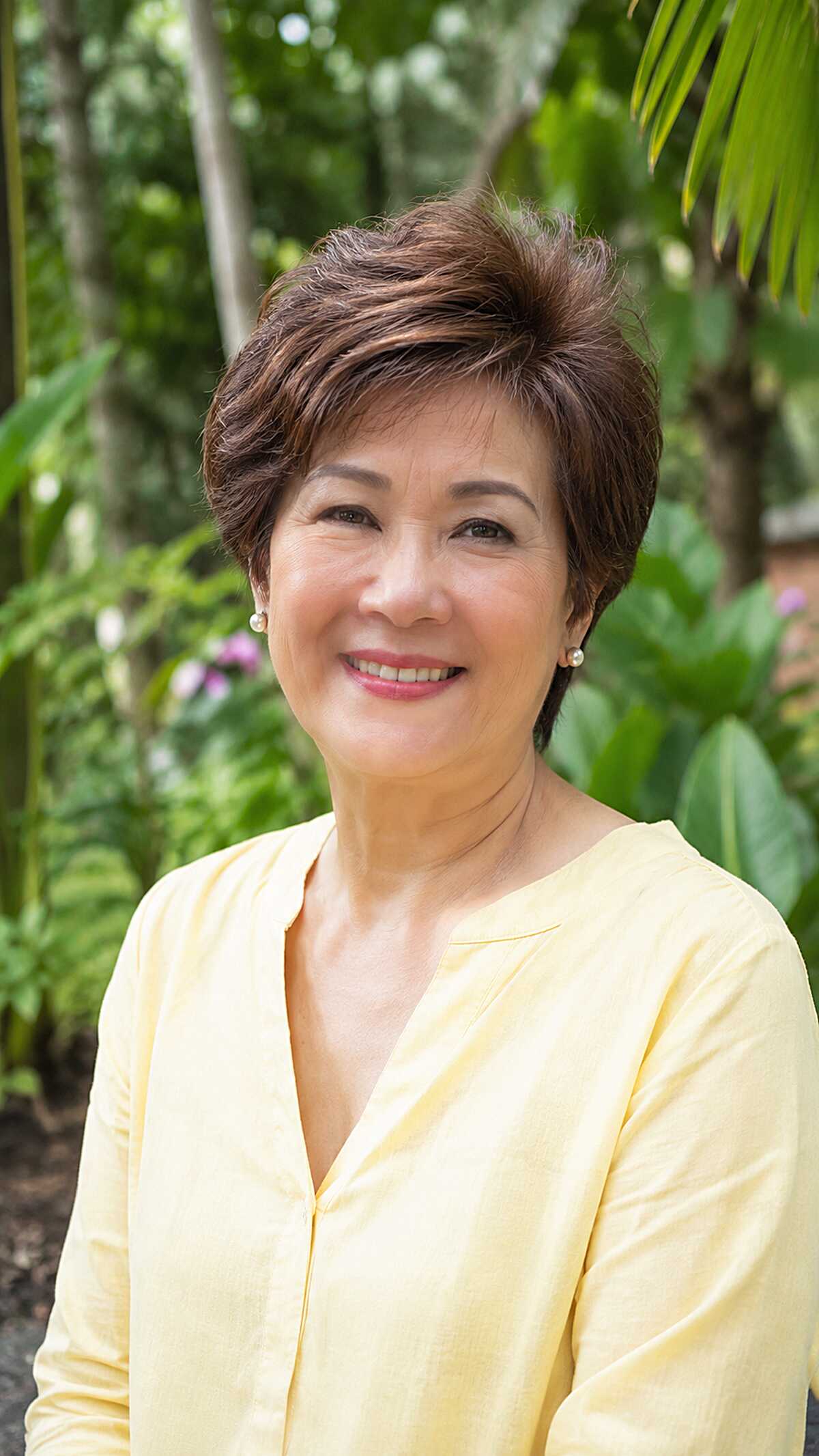 Lifted brunette pixie cut with swept crown volume