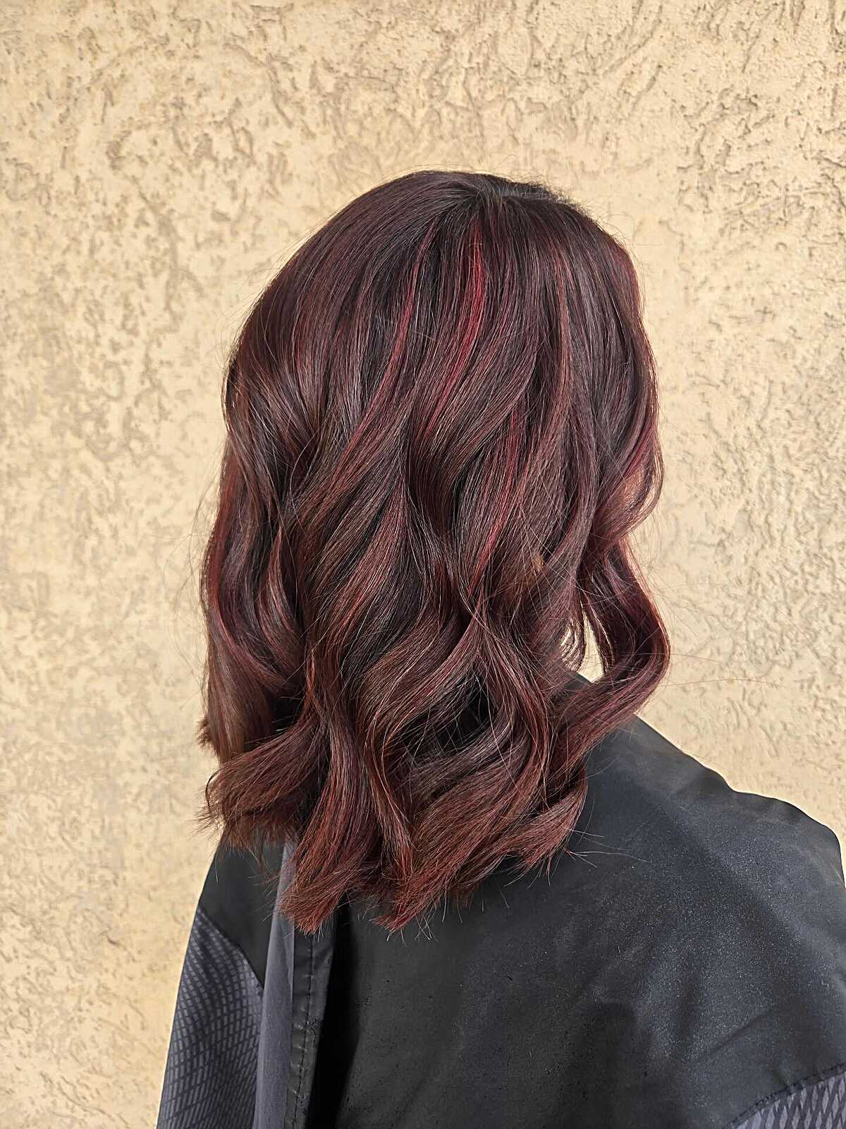 Wavy dark plum brown lob with mulled wine red highlights