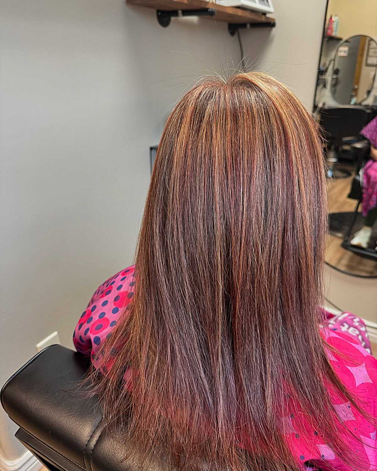 Straight medium brown hair with natural auburn highlights
