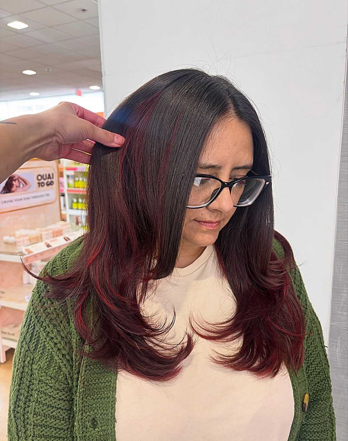 Long dark brown blowout with peekaboo crimson red accents