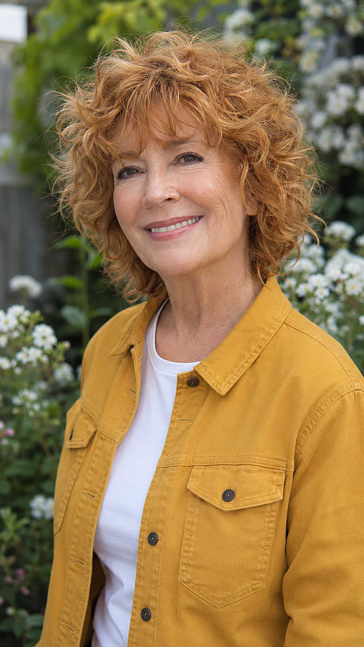 Strawberry blonde curly shag with short bangs