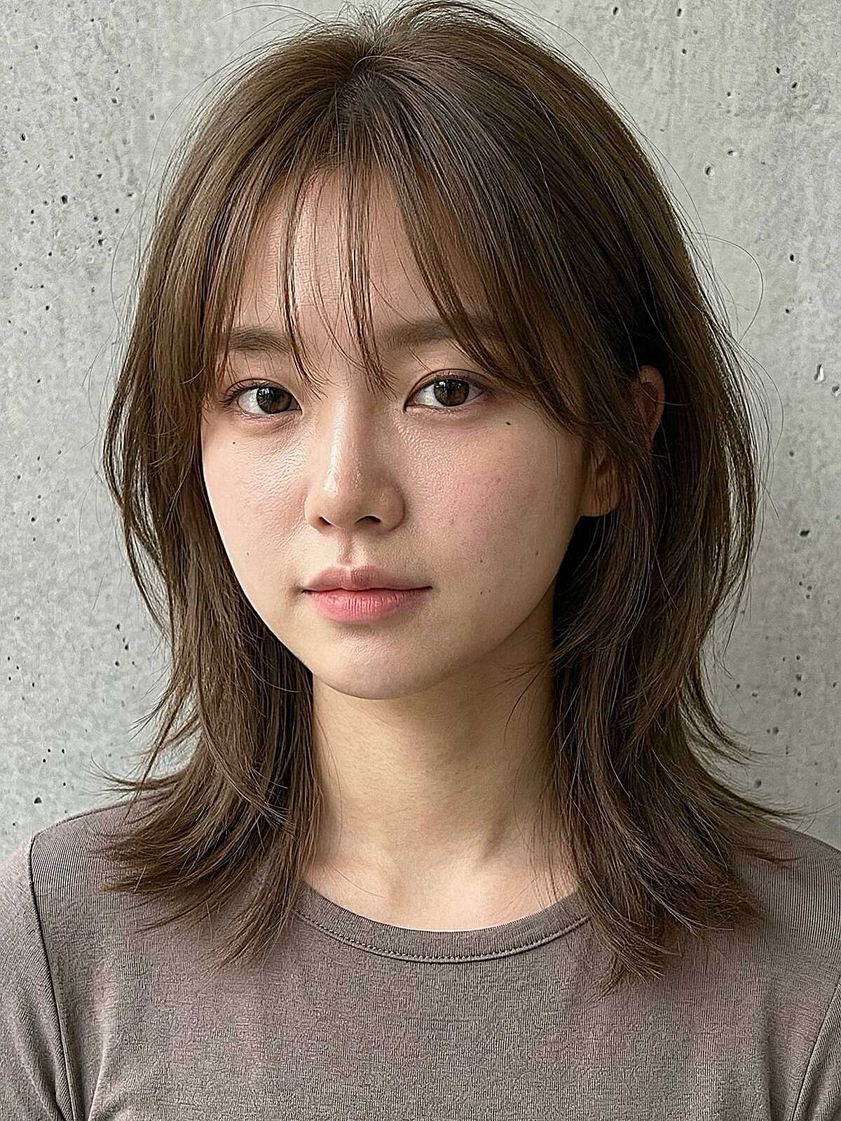Warm ash brown medium shaggy layers with thin fringe