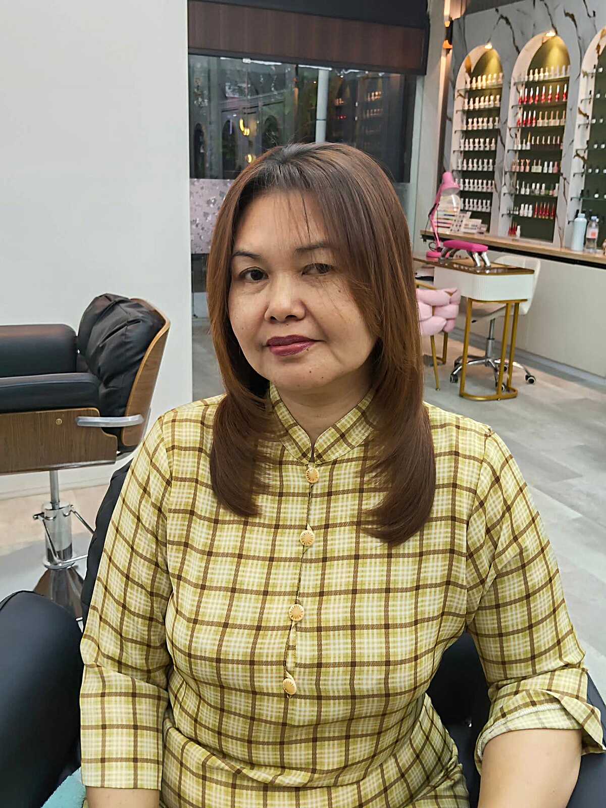 Warm chestnut brown medium layers with subtle side part