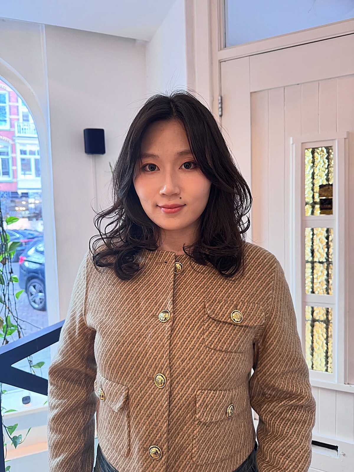 Wavy black medium layered cut with center part