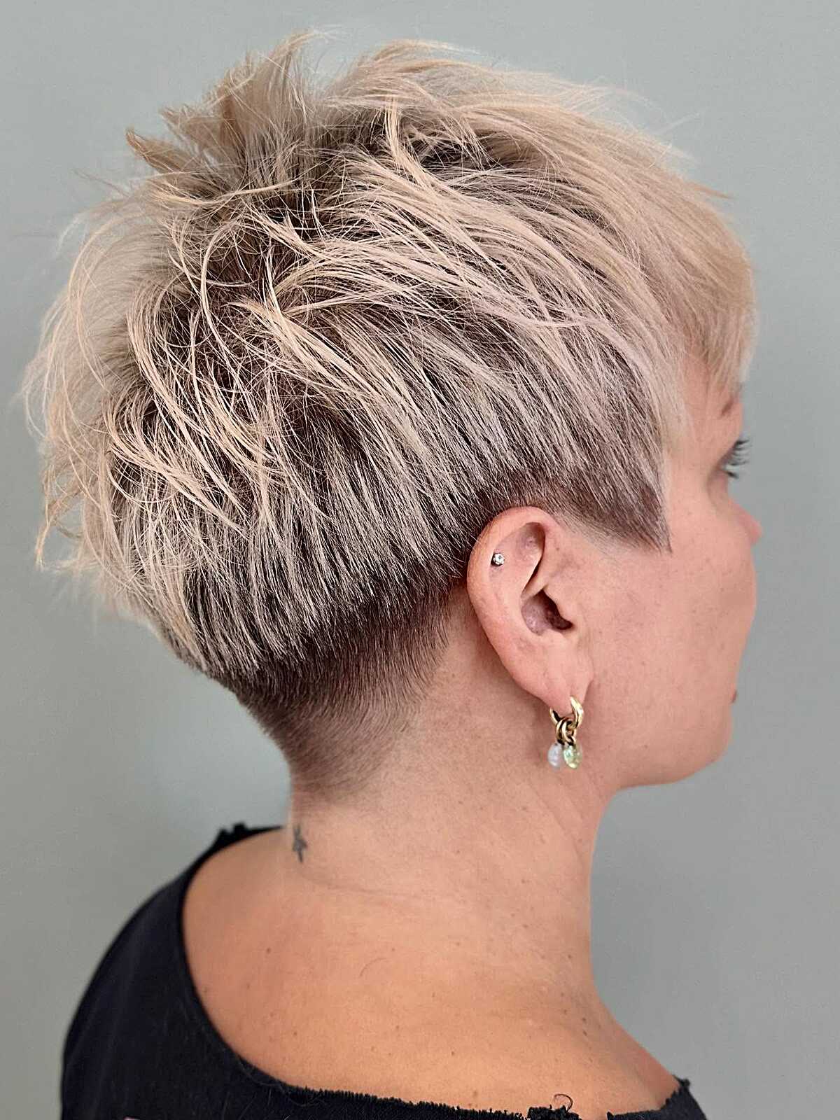 Ash blonde spiky textured pixie with tapered undercut