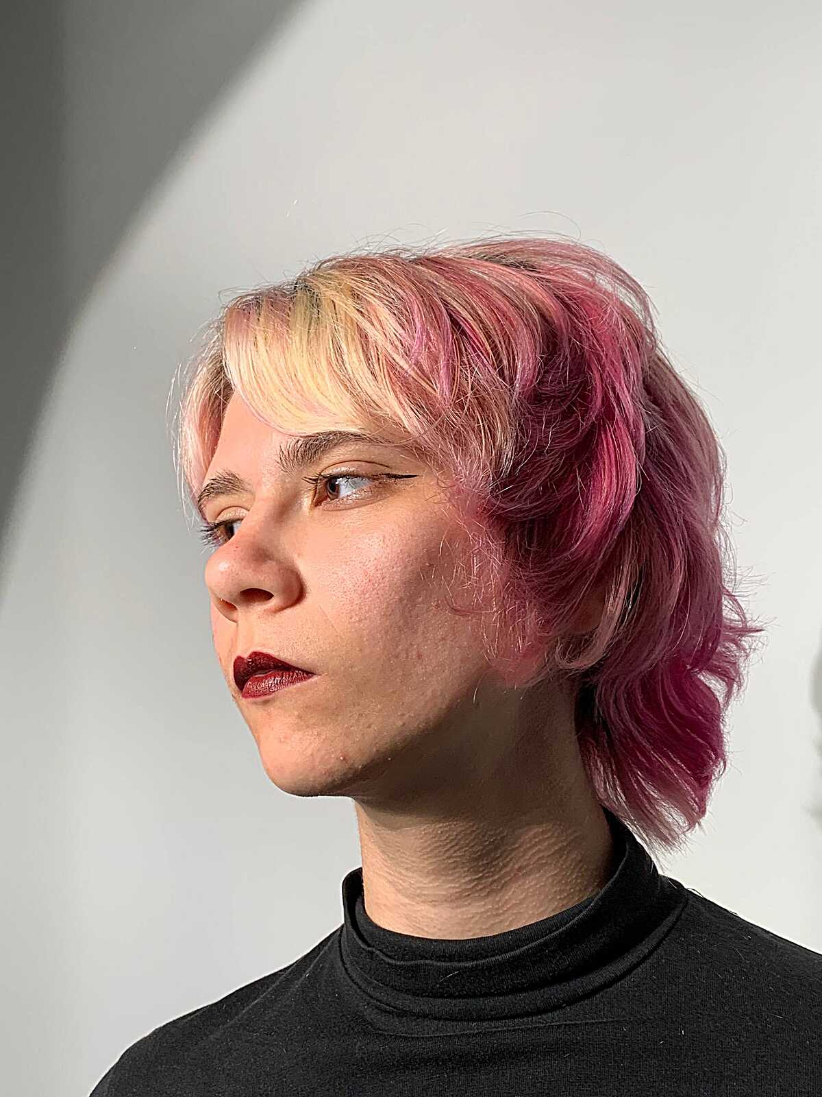 Blonde and pink jellyfish mullet with short bangs