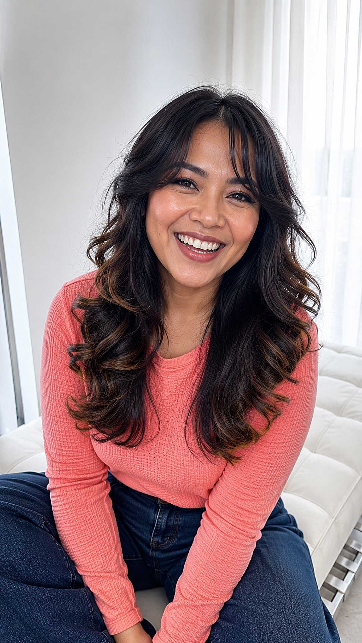 Bouncy curled long layers on jet black hair