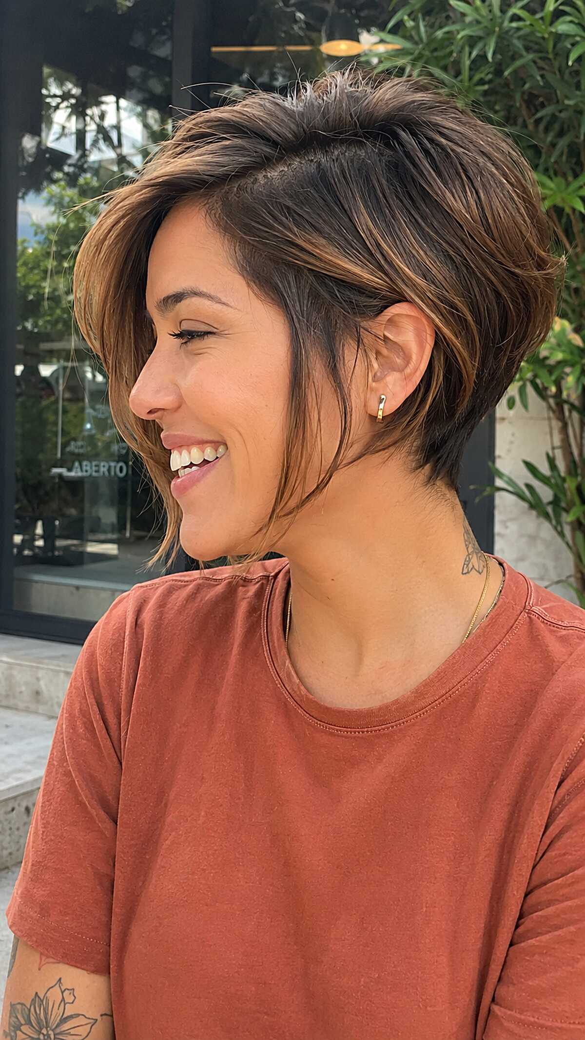 Brunette angled pixie bob with caramel highlights