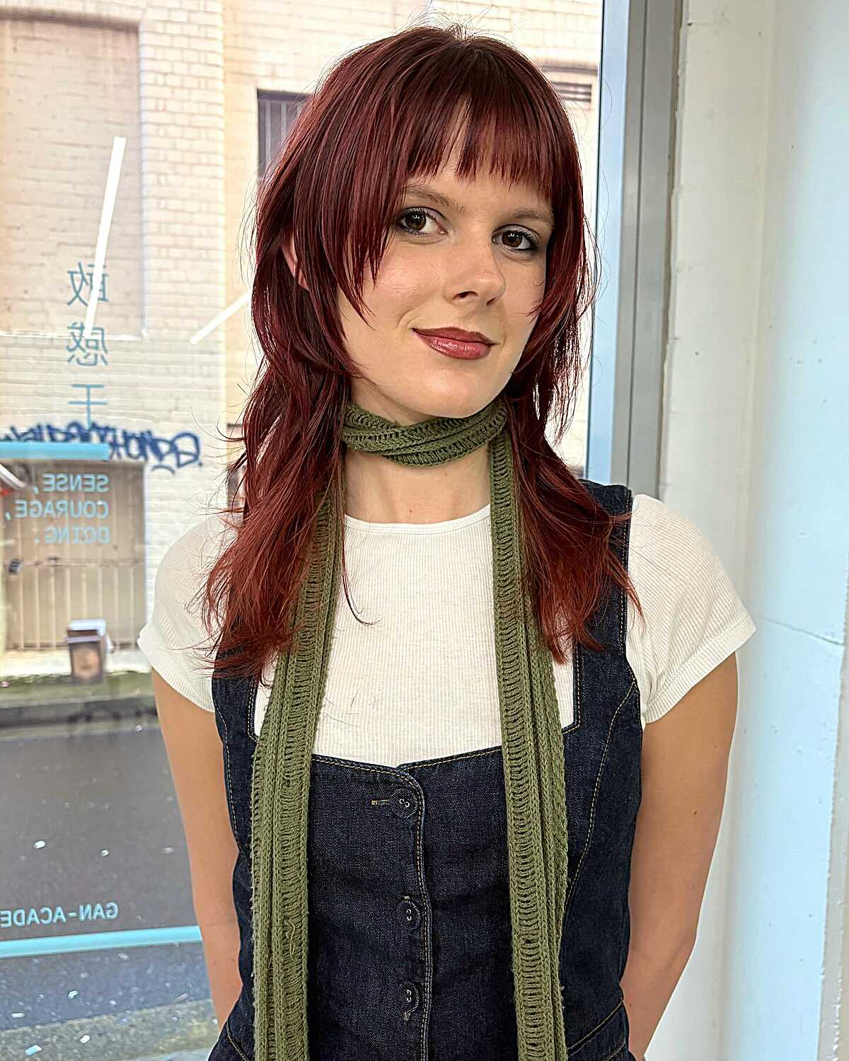 Shoulder-length cherry red hush cut with choppy layers
