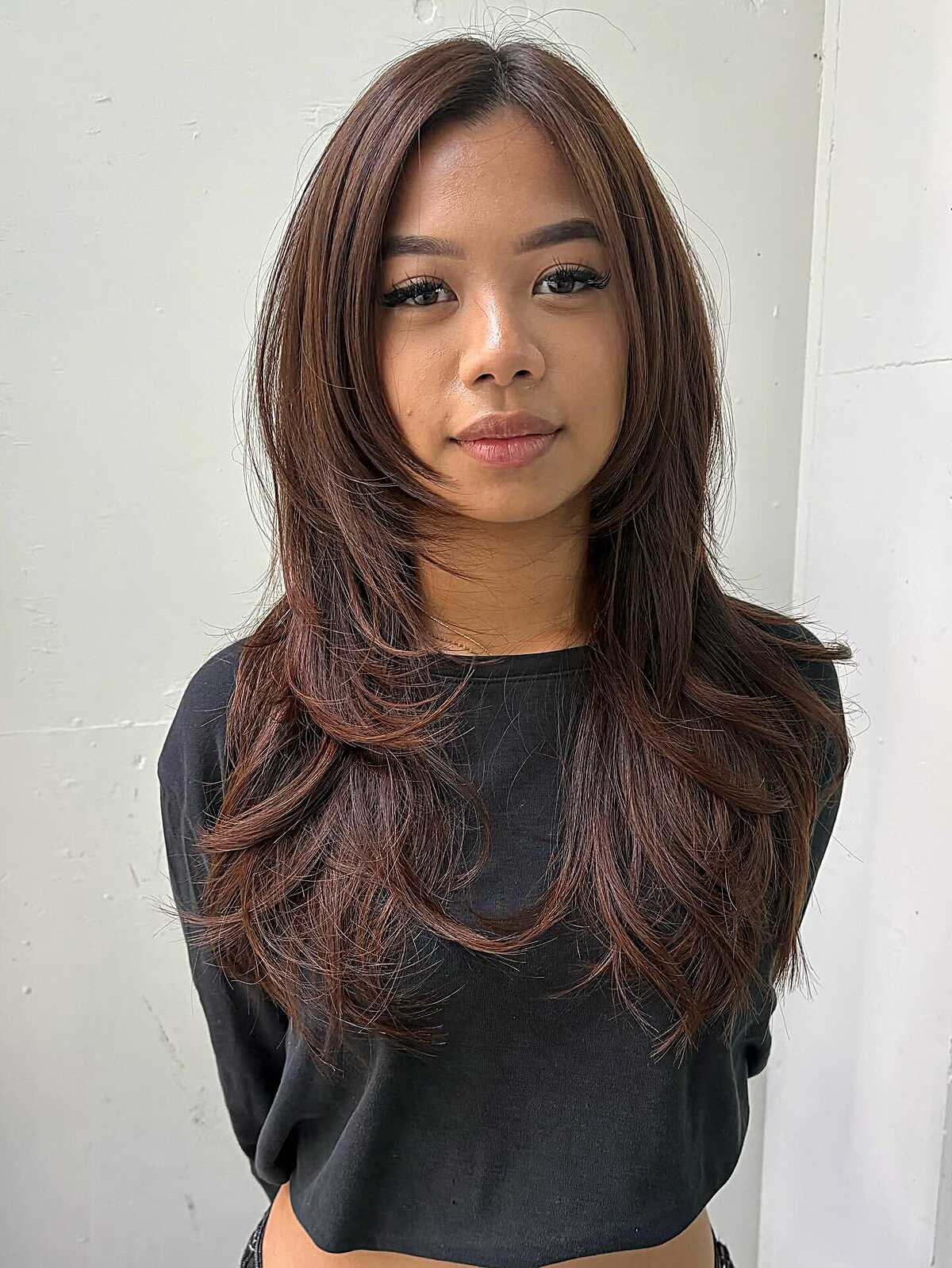 Long chestnut brown hush cut without bangs and layers