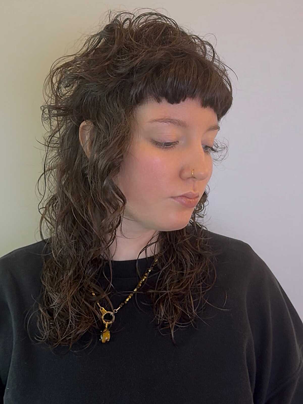 Curly brown shag with short straight baby bangs