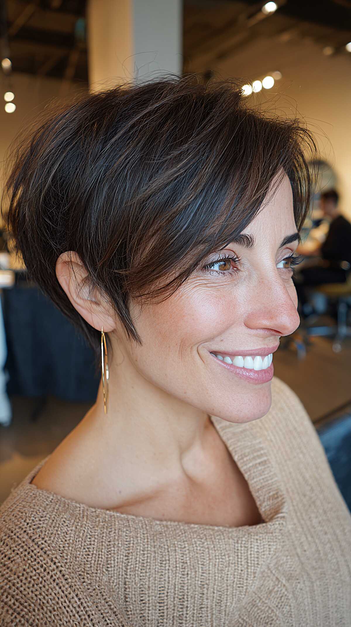 Dark chocolate angled pixie with long side-swept fringe