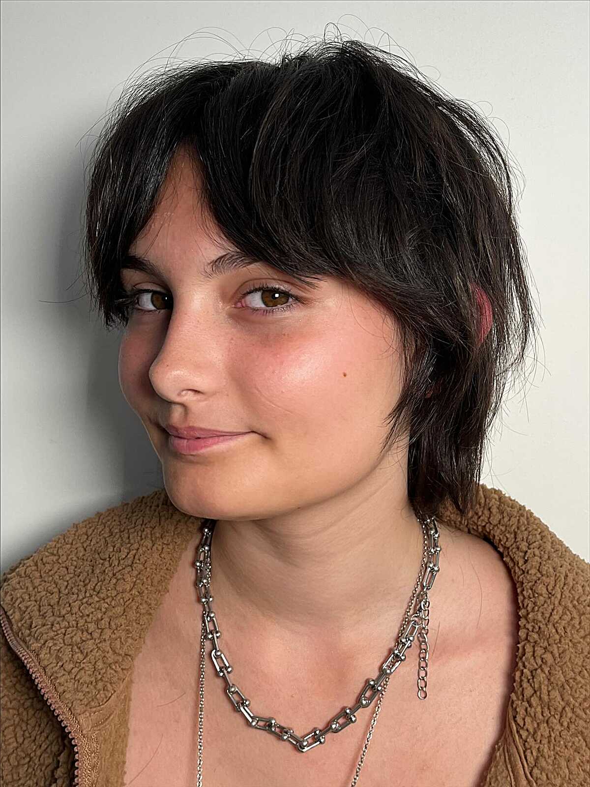Dark brunette short choppy shag with wispy bangs