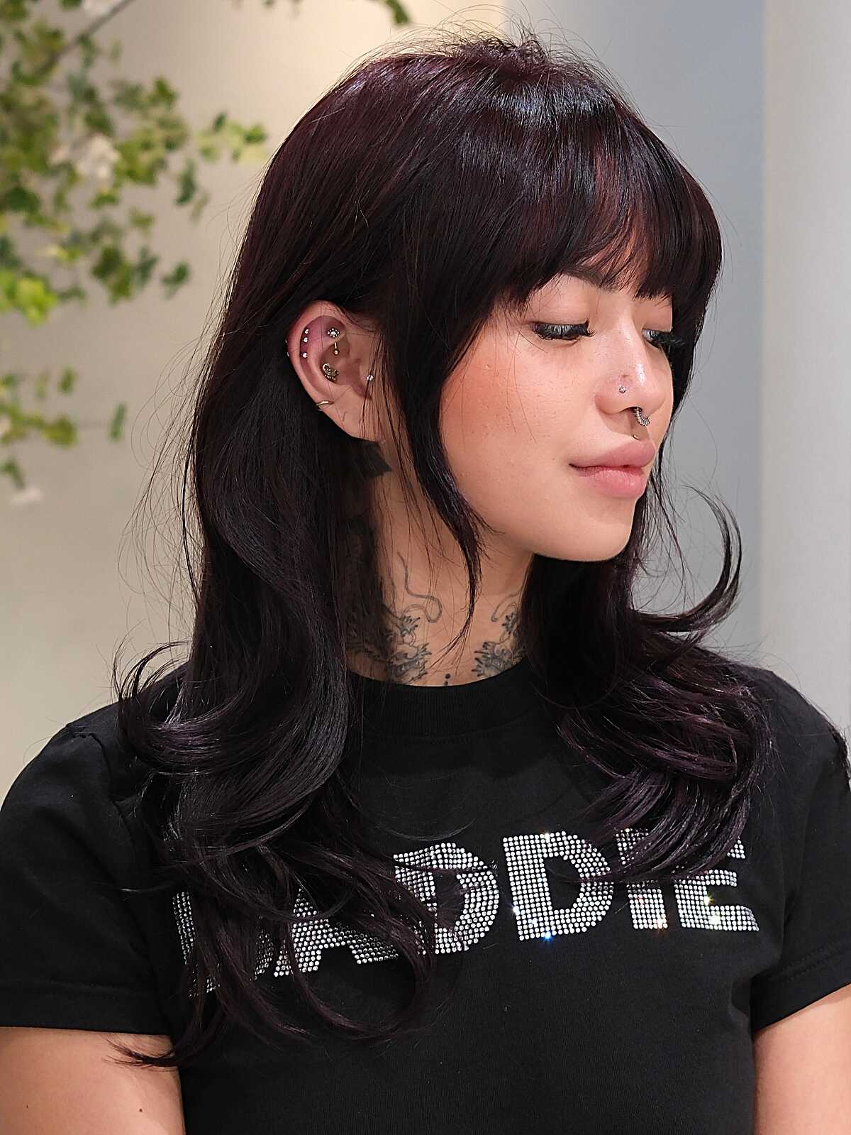 Long dark plum hush cut with full wispy bangs