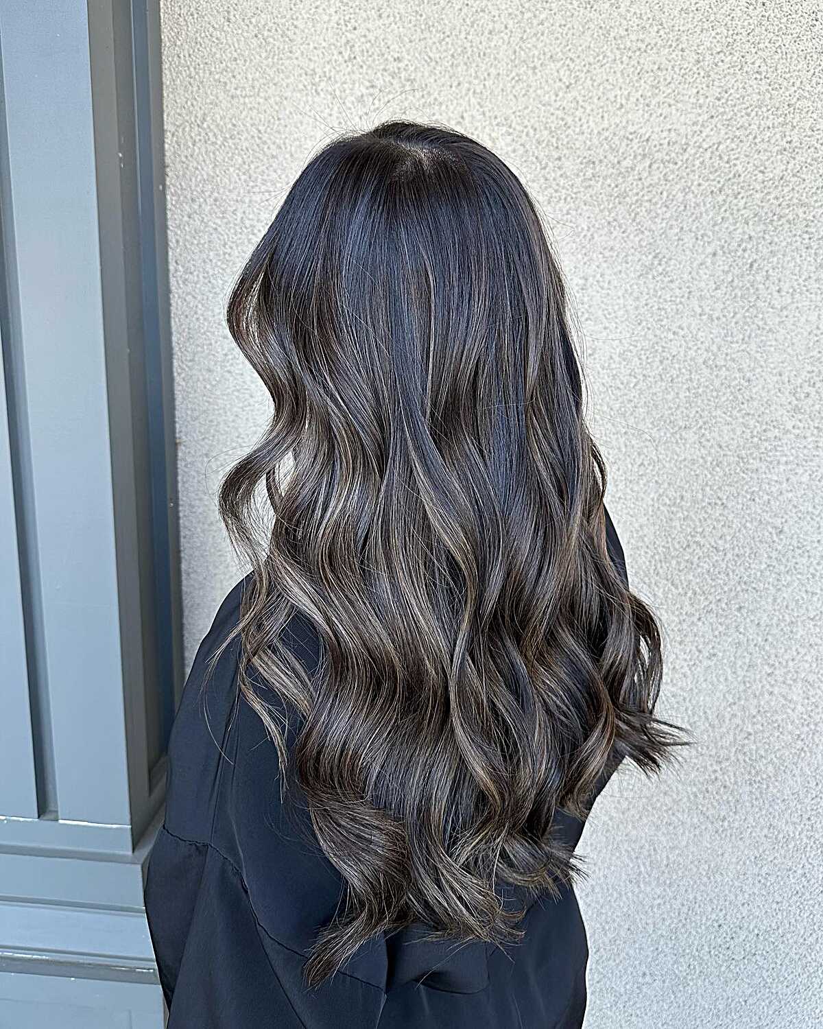 Side view of dark hair with ash undertone babylights