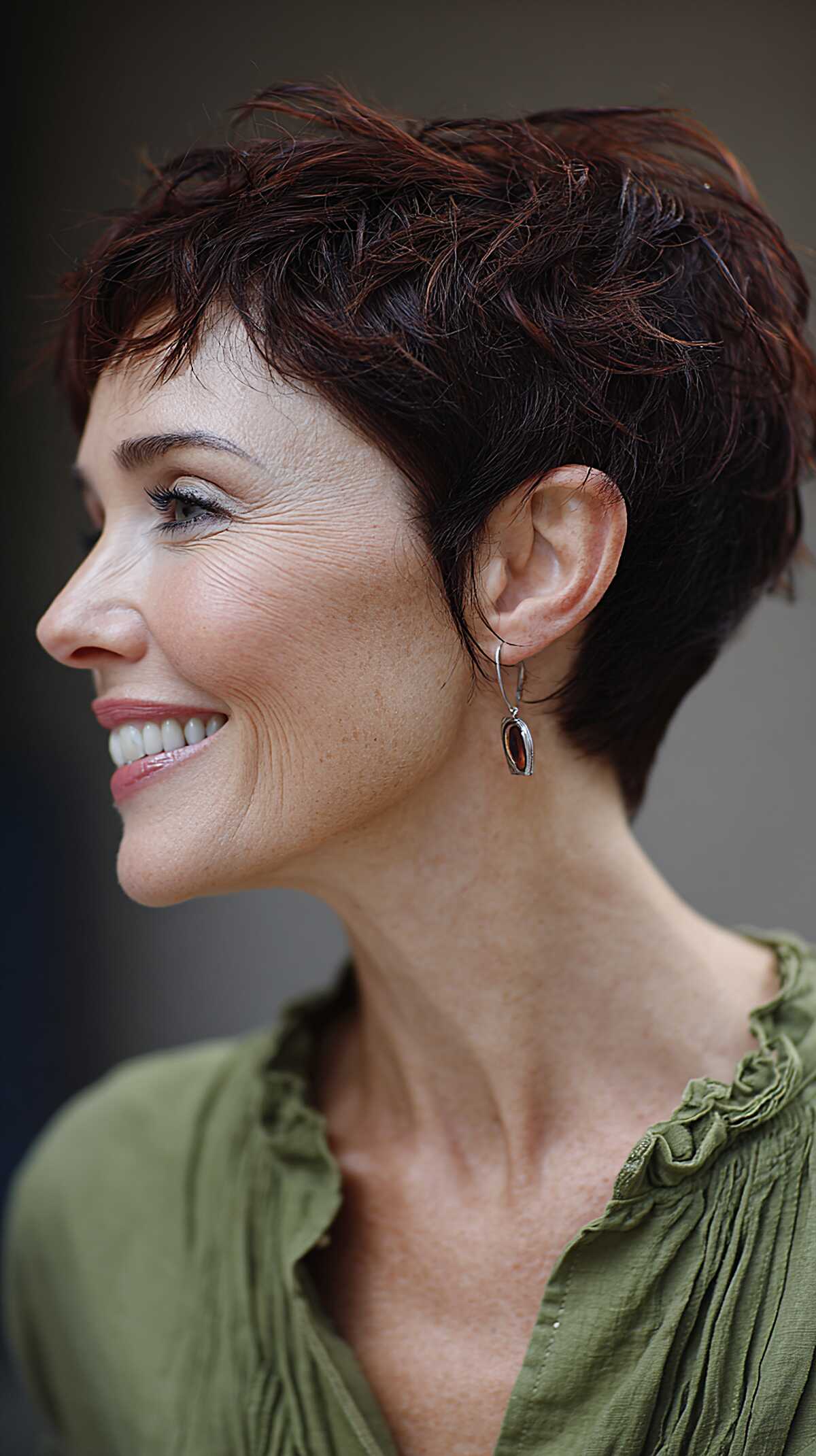 Deep plum-burgundy cropped angled pixie with waves