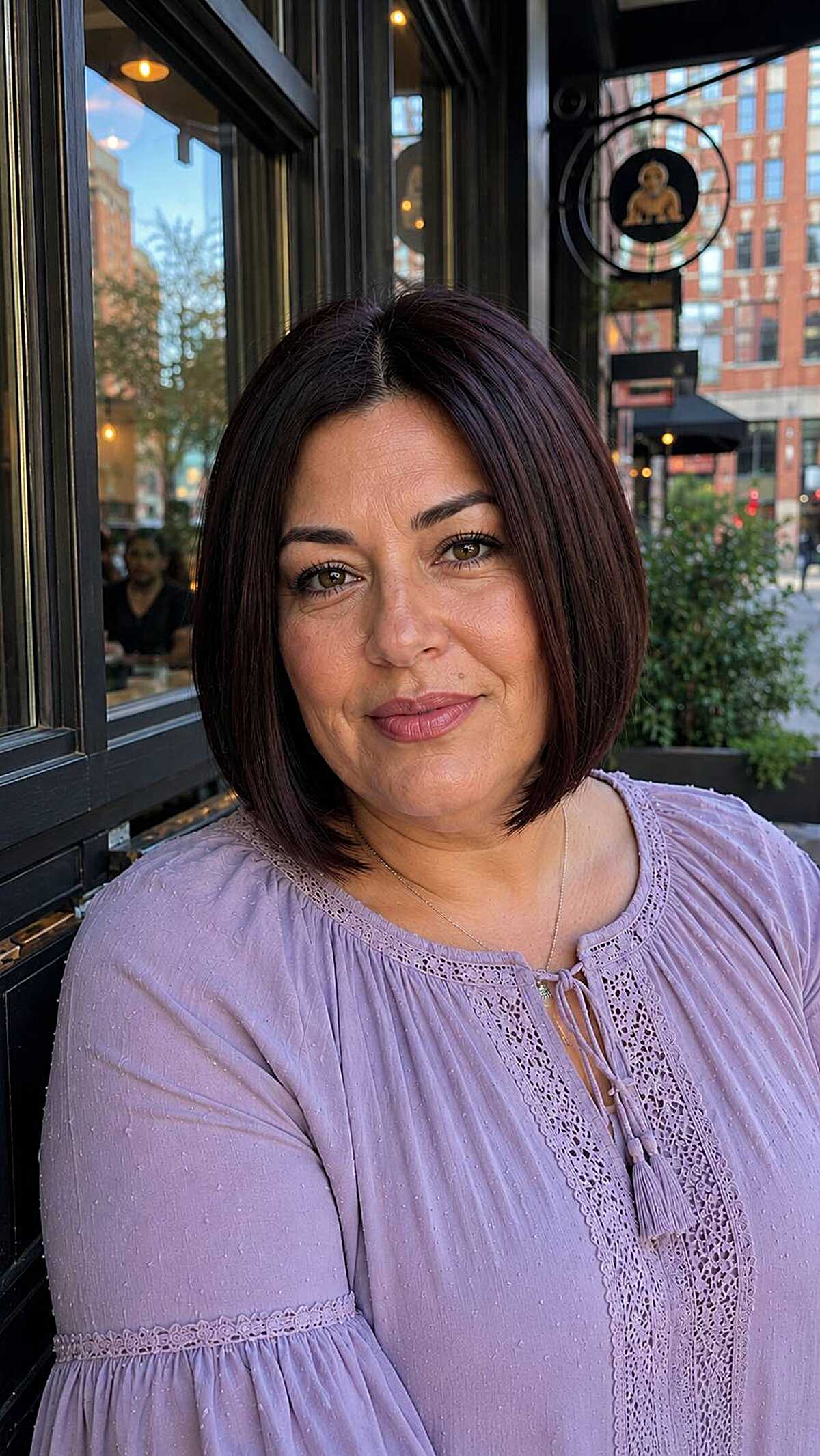 Deep plum straight chin-length bob with clean lines