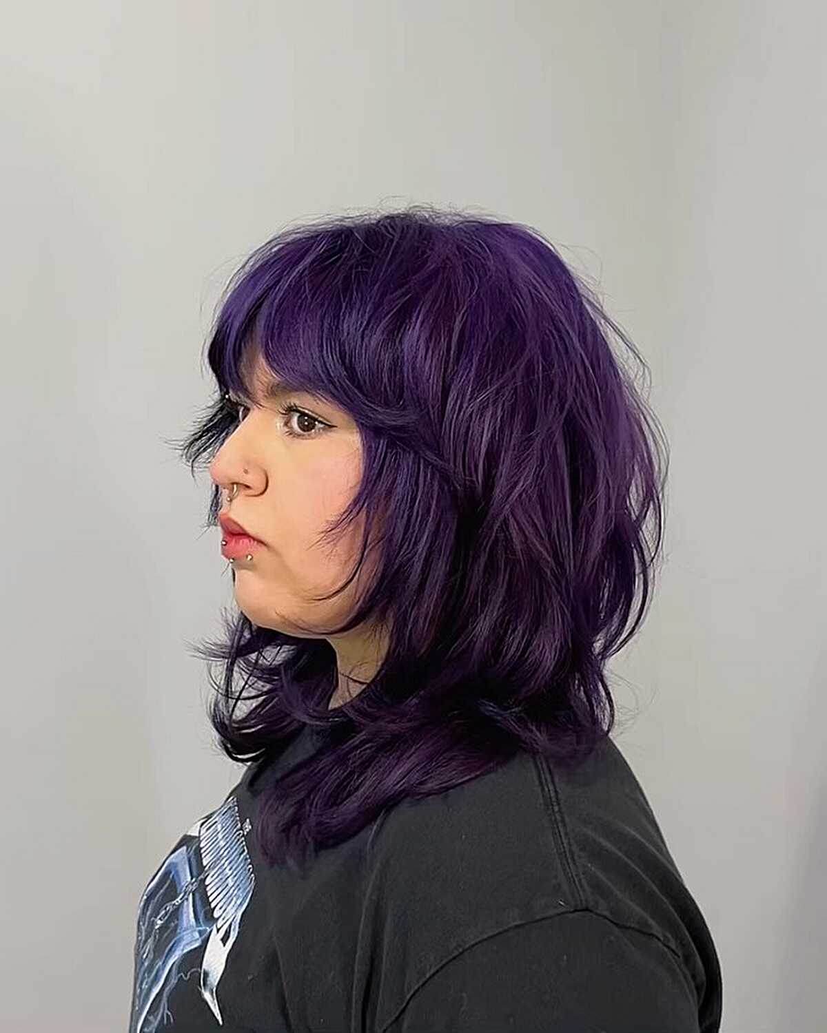 Shoulder-length deep violet purple shag with full bangs