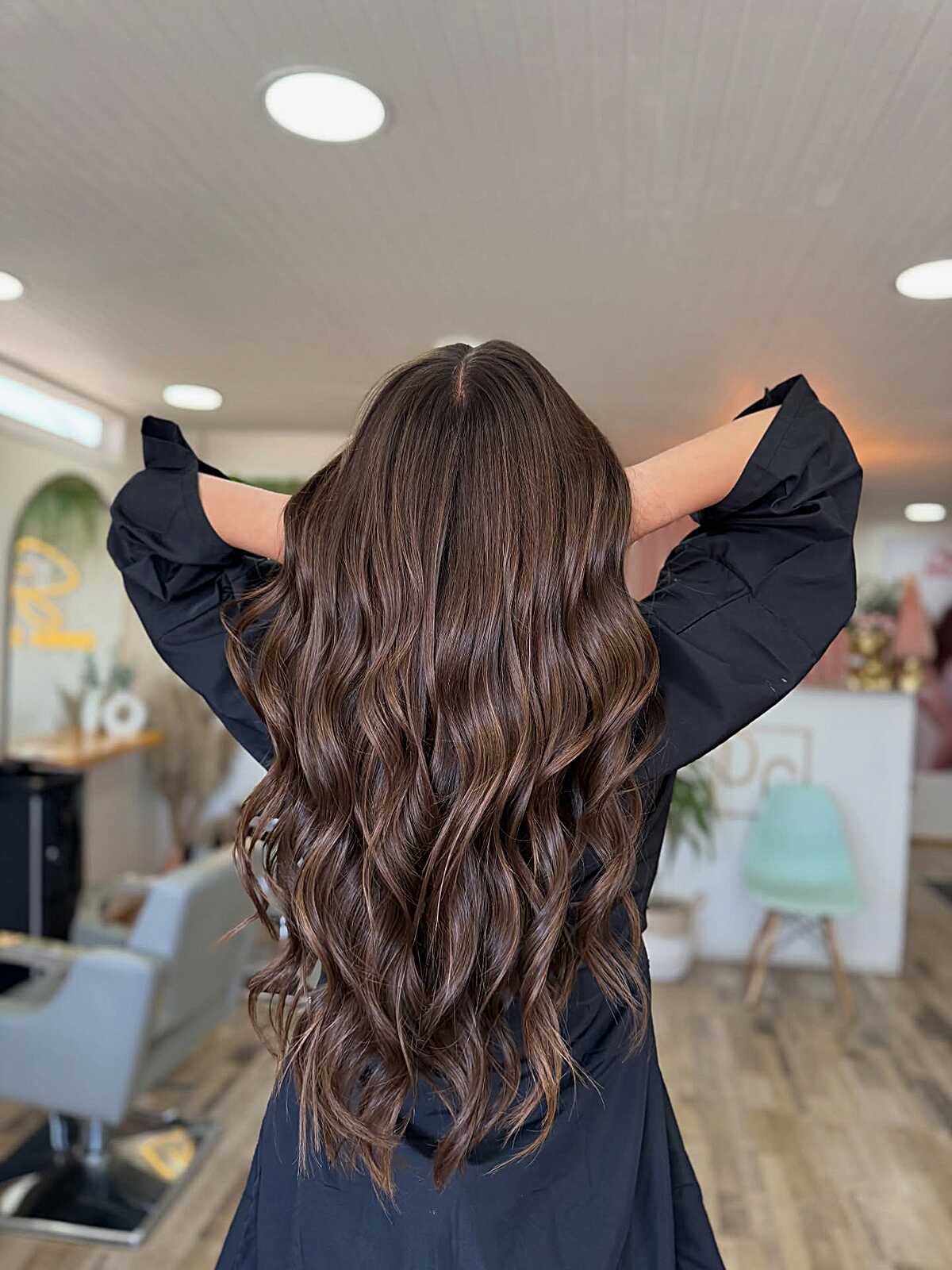 Long wavy espresso brown hair with subtle ash babylights