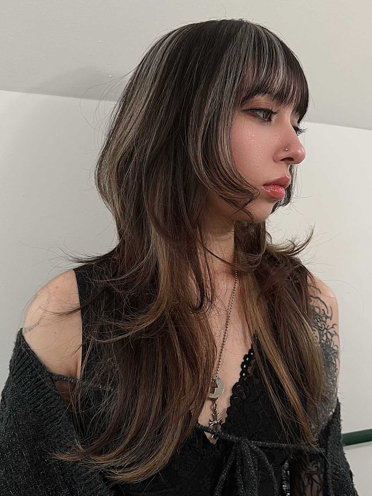 Long highlighted brunette hush cut with straight bangs