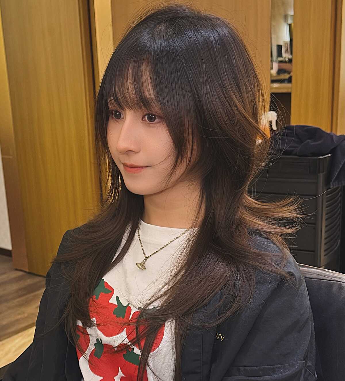 Long dark brown Korean hush cut with wispy curtain bangs