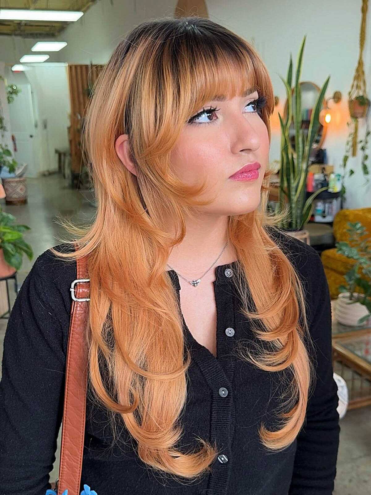 Long peach copper hush cut with full Bardot-style bangs