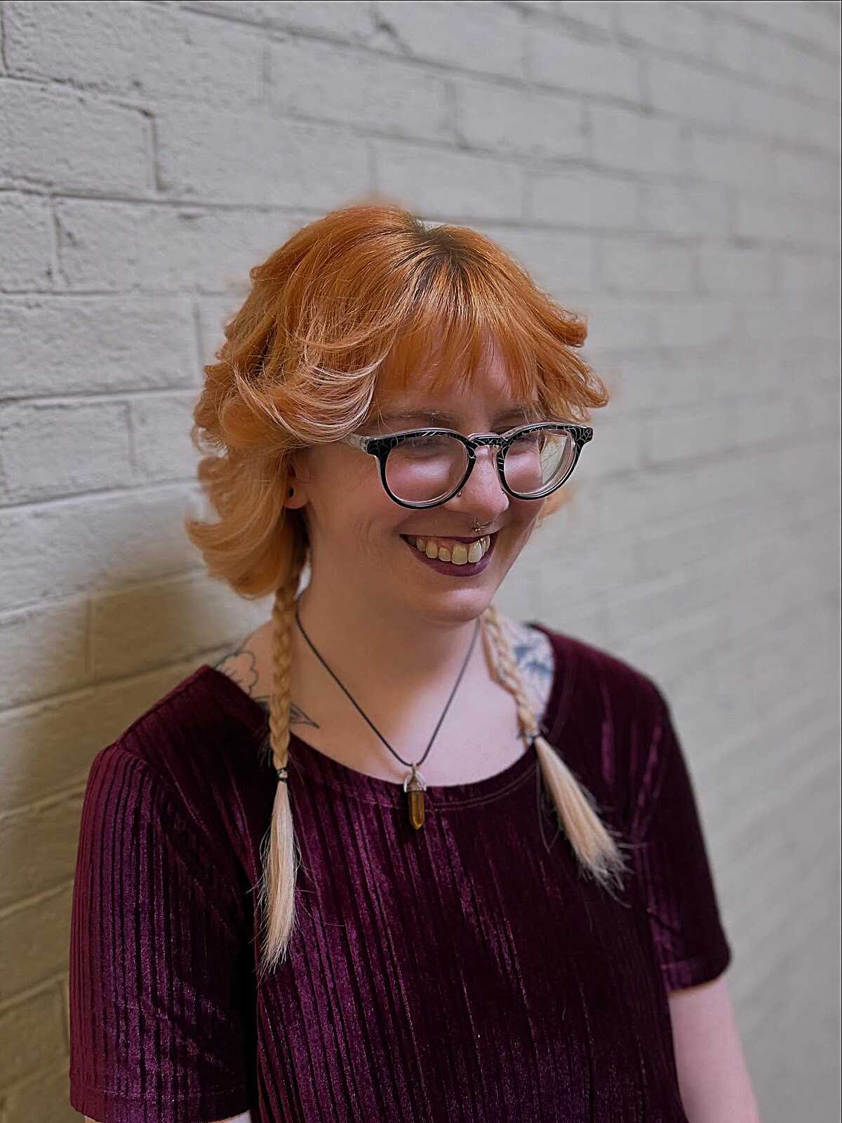 Short peach orange shag with long braided tail pieces