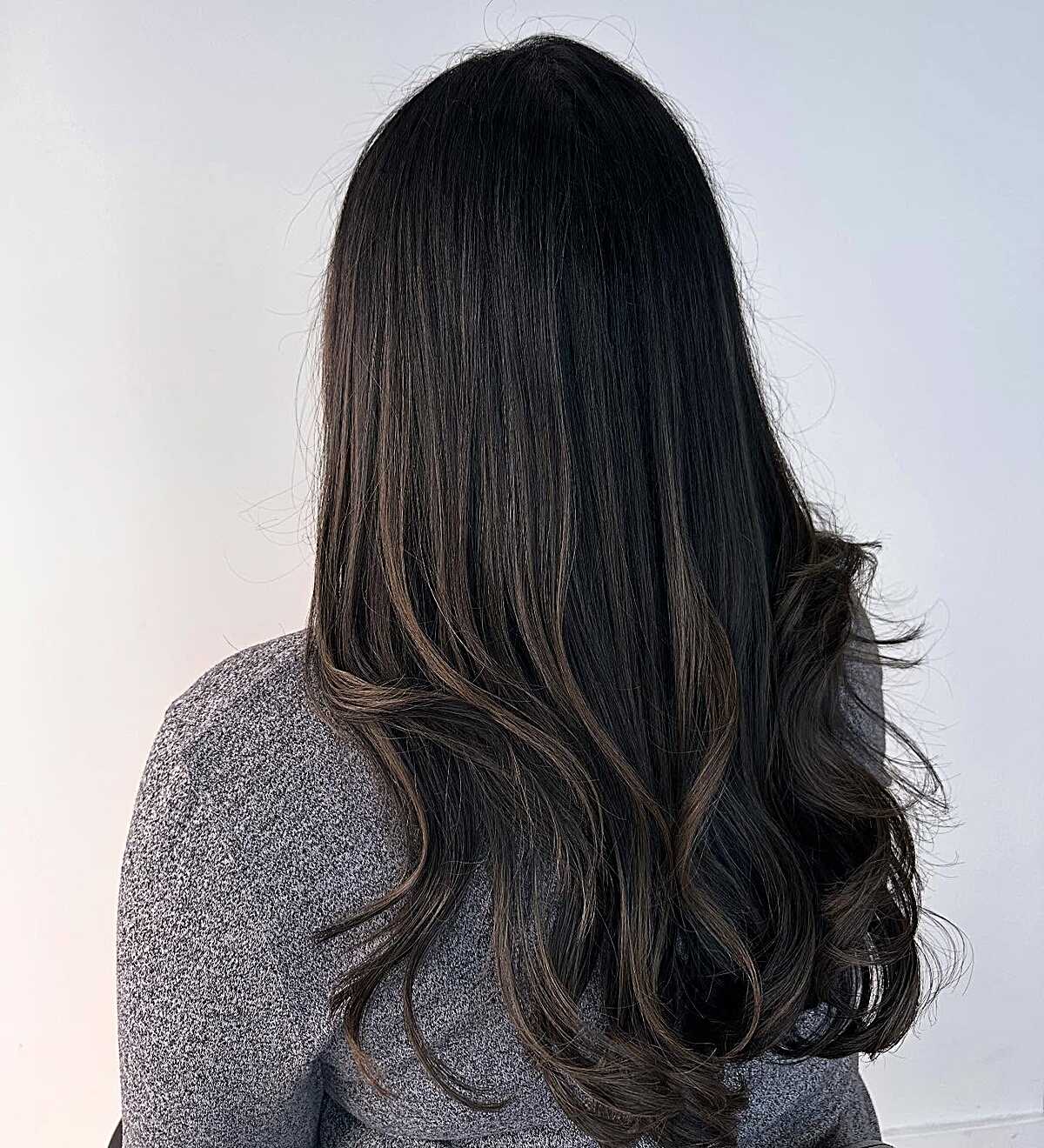 Jet black blowout with peek-a-boo ashy babylights