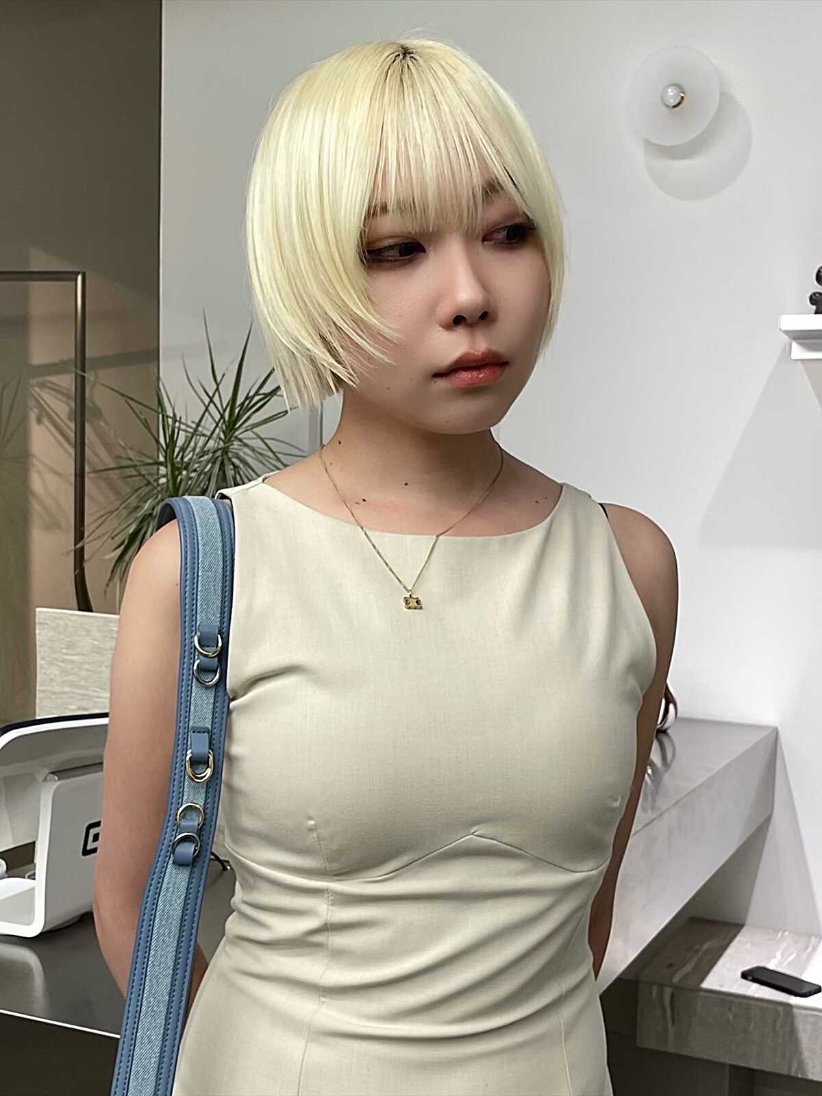Platinum blonde tapered short bob with wispy fringe