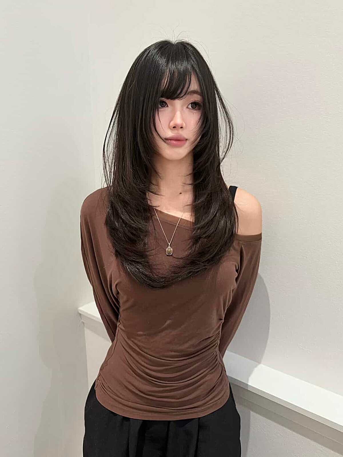 Long polished black hush cut with straight-across bangs