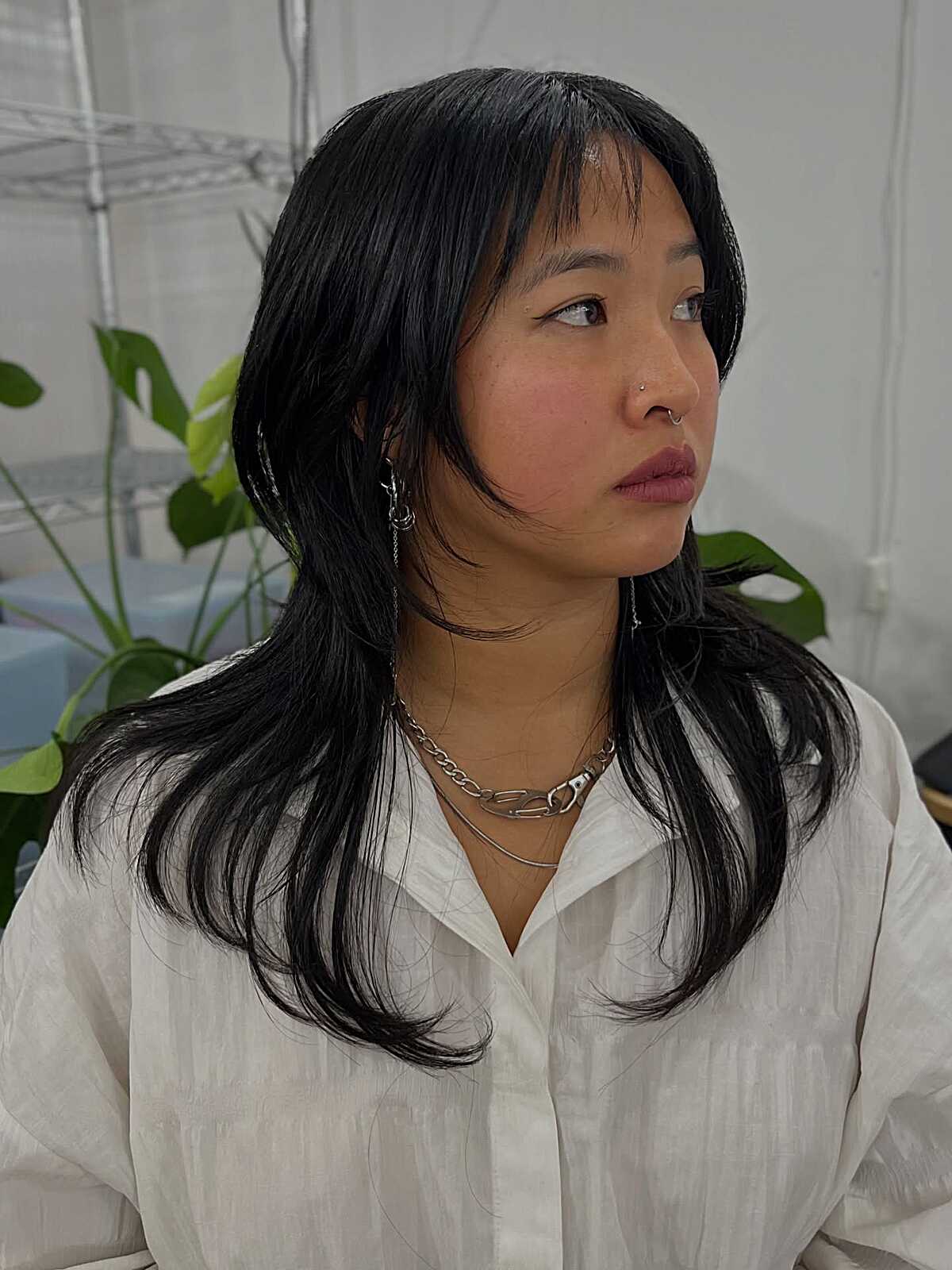 Medium-length sleek black hush cut with curved layers