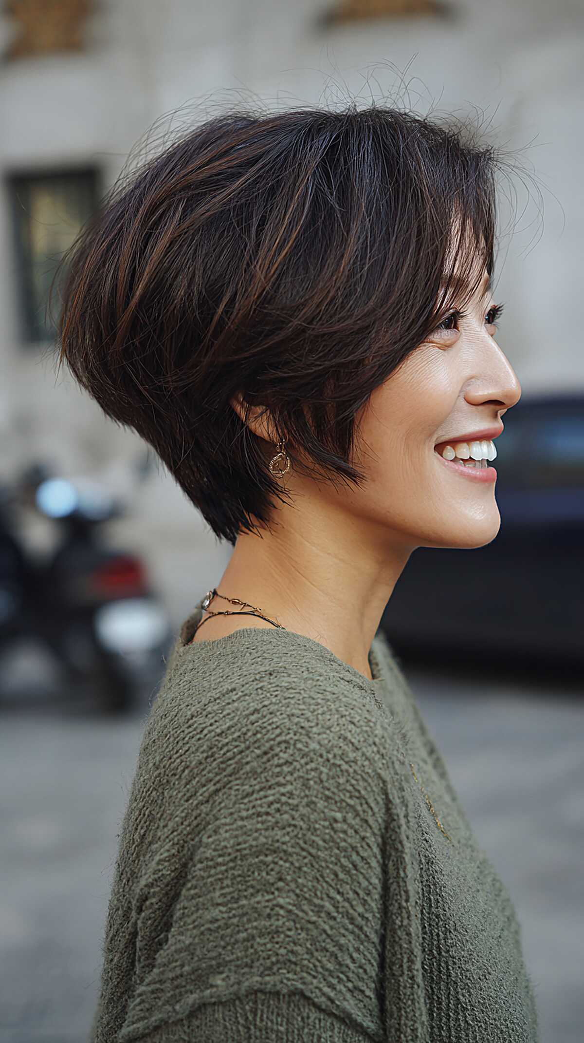 Textured brunette angled pixie bob with soft graduation