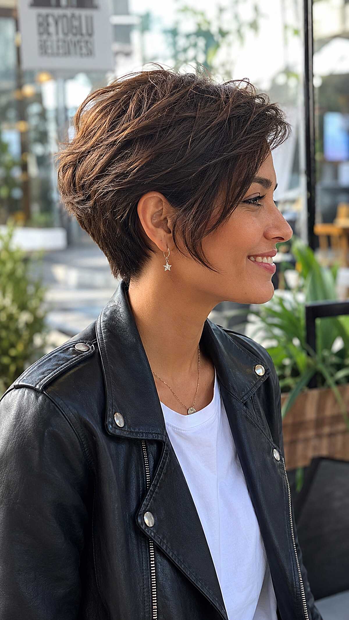 Textured brunette angled pixie with windswept layers