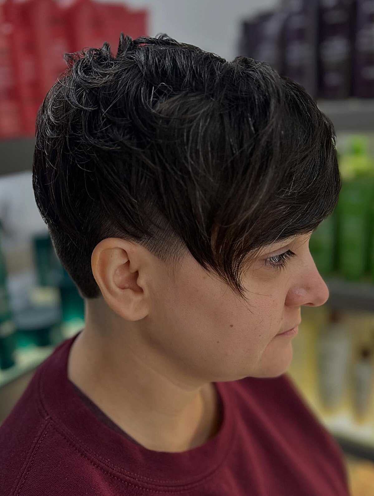 Dark textured pixie crop with curly top and tapered sides