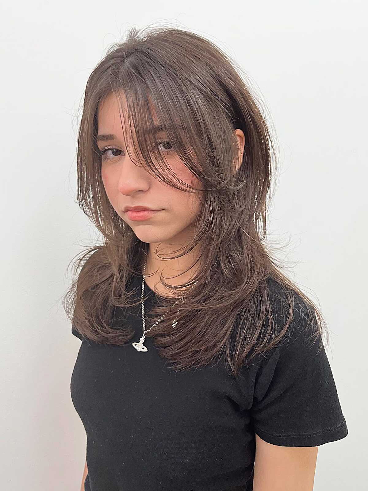 Medium-length tousled ash brown hush cut with layers